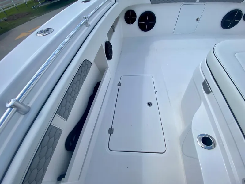 Slide: The Image of 2022 Invincible 35 Catamaran deck with storage compartments and seating. - 29