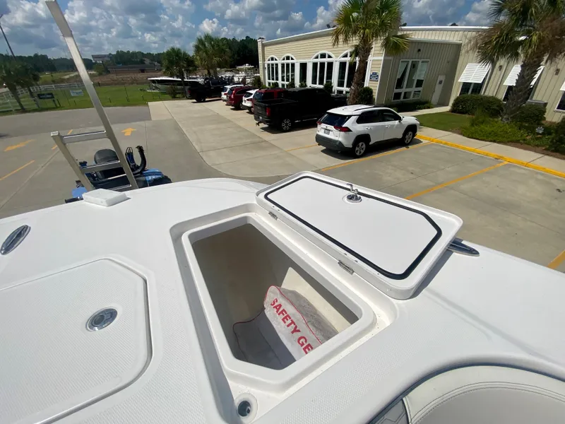 Slide: The Image of 2022 Invincible 35 Catamaran with open storage compartment and safety gear. - 31