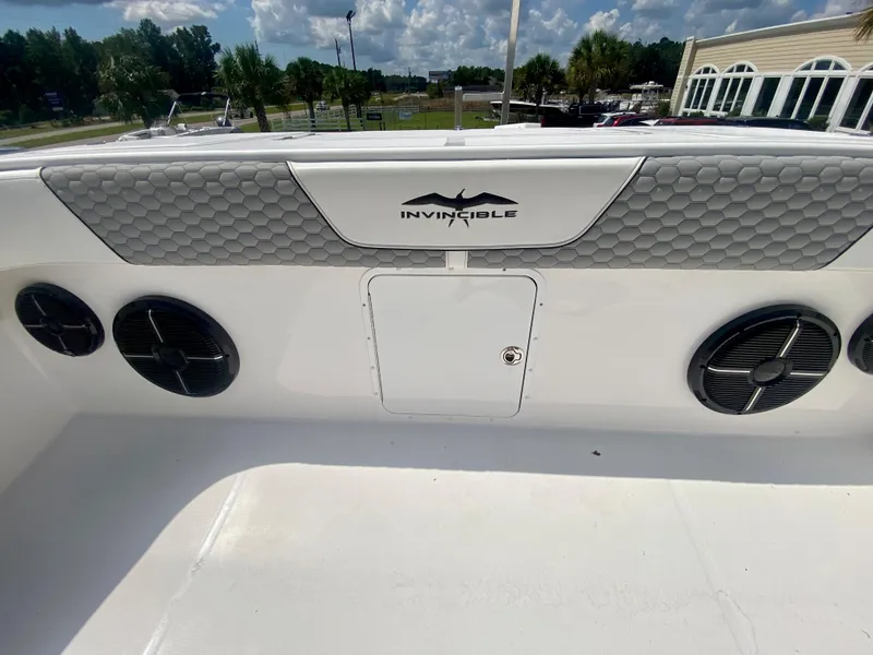 Slide: The Image of 2022 Invincible 35 Catamaran boat interior with speakers and storage compartment. - 34