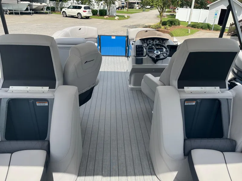 Slide: The Image of 2024 Starcraft SLS 3 boat interior with modern seating and steering console. - 14