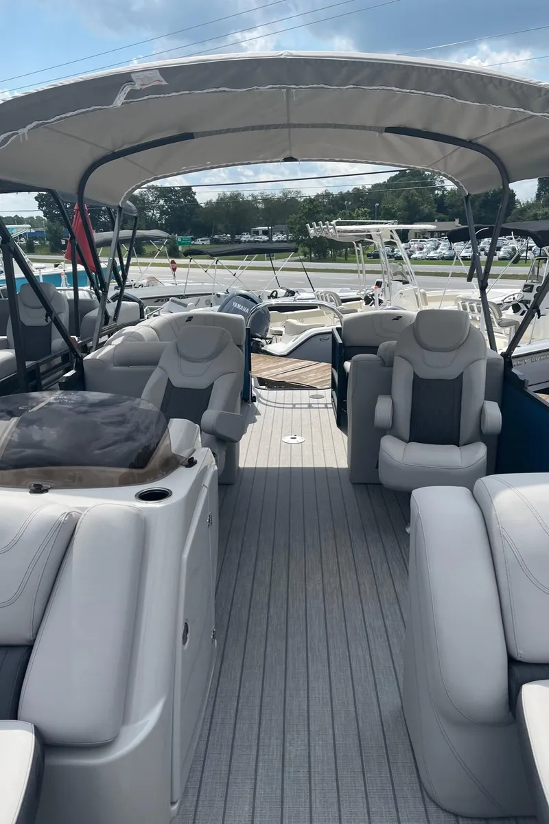 Slide: The Image of 2024 Starcraft SLS 3 pontoon boat with spacious seating and canopy. - 15