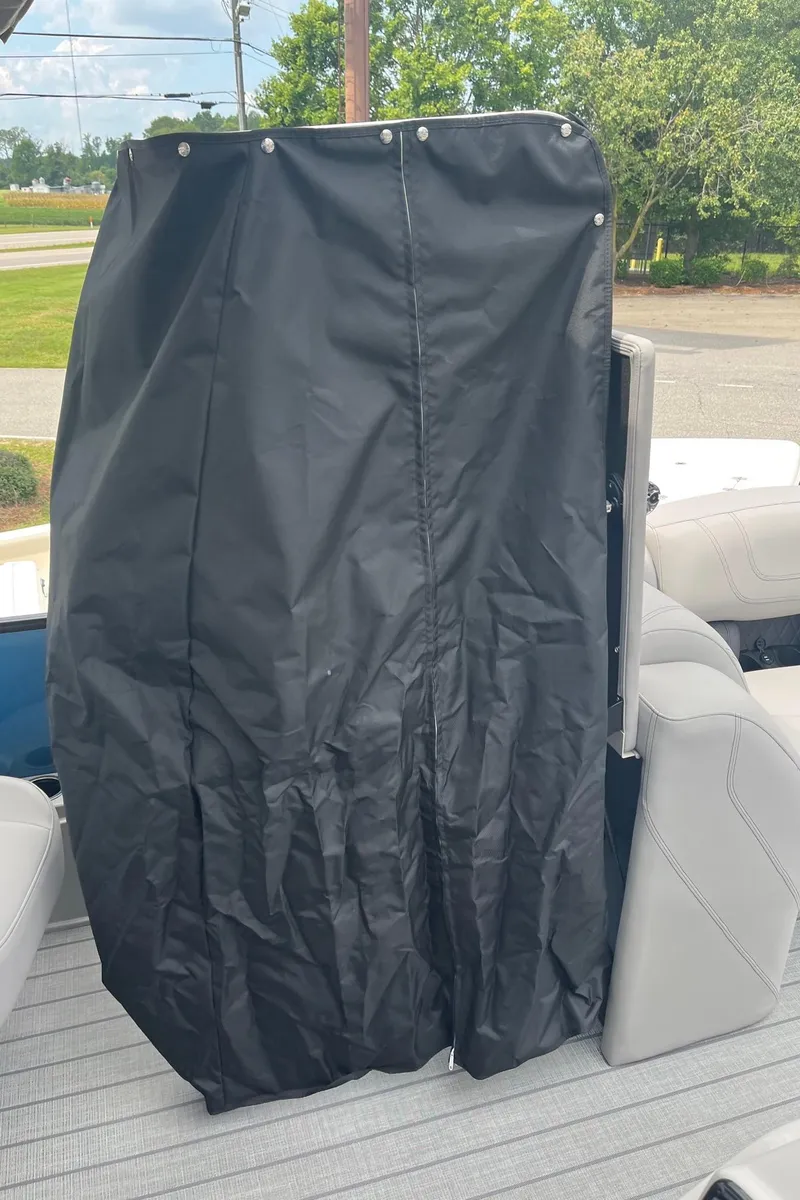 Slide: The Image of 2024 Starcraft SLS 3 boat interior with black cover and white seating. - 17