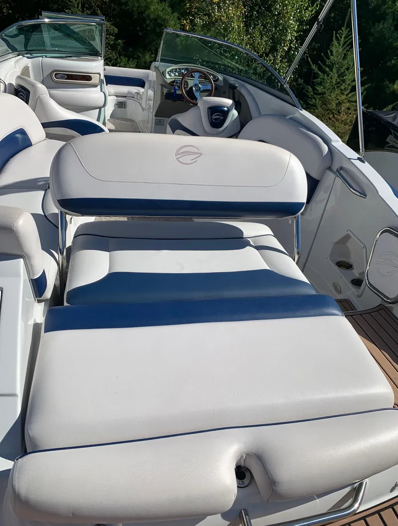 Slide: The Image of 2012 Crownline E6 boat interior with white and blue seating. - 11
