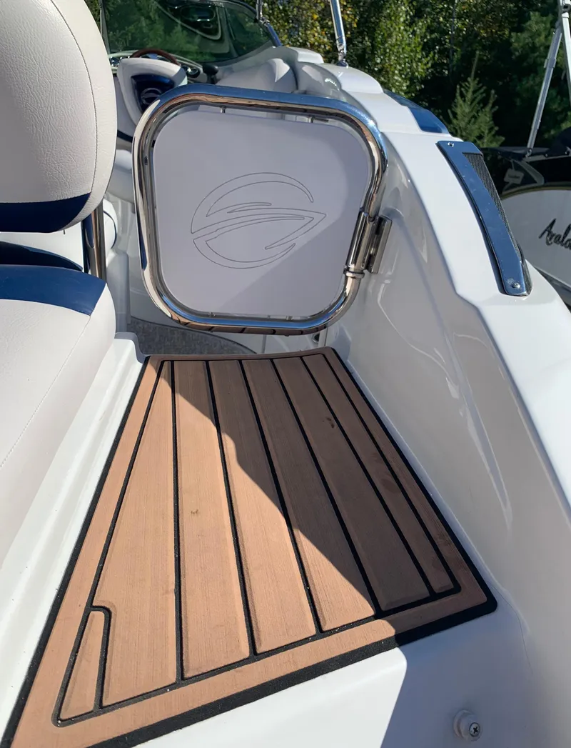 Slide: The Image of 2012 Crownline E6 boat with teak flooring and white interior. - 14