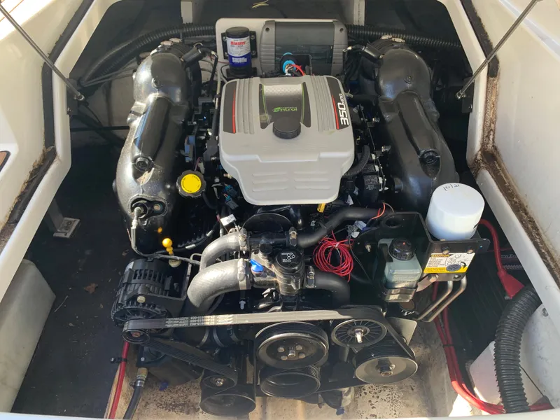 Slide: The Image of 2012 Crownline E6 boat engine compartment with a powerful inboard motor. - 19