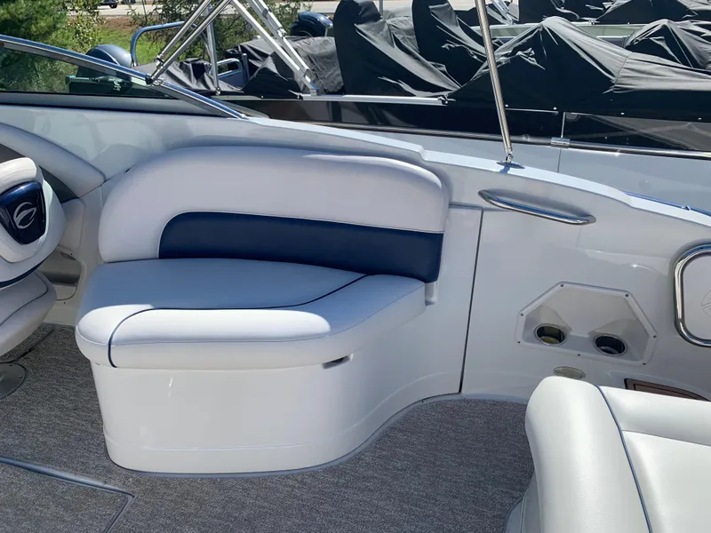Slide: The Image of 2012 Crownline E6 boat interior with white and blue seating. - 25