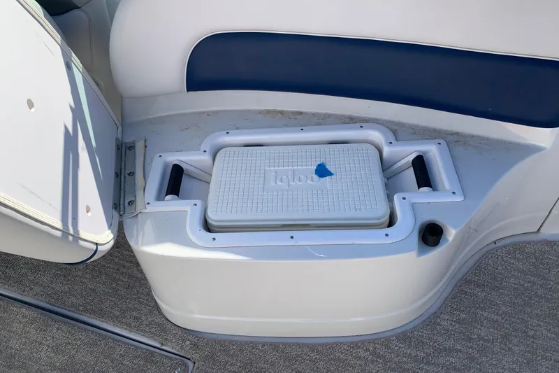 Slide: The Image of 2012 Crownline E6 boat with built-in cooler storage compartment. - 26
