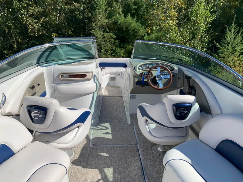 Slide: The Image of Interior of 2012 Crownline E6 boat with white and blue seating. - 27