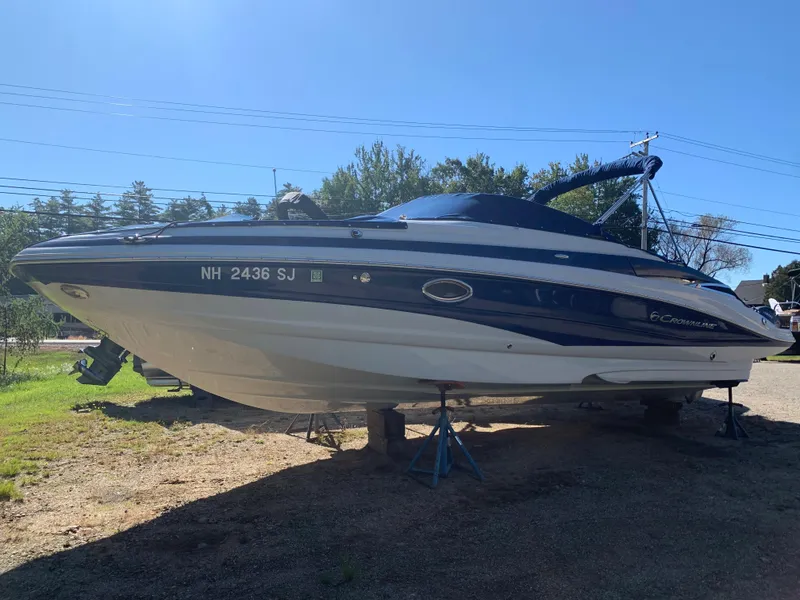 Slide: The Image of 2012 Crownline E6 boat on stands, side view, outdoors. - 3