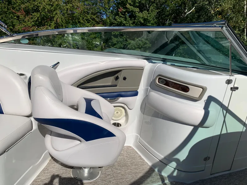 Slide: The Image of Interior of a 2012 Crownline E6 boat with white and blue seating. - 35