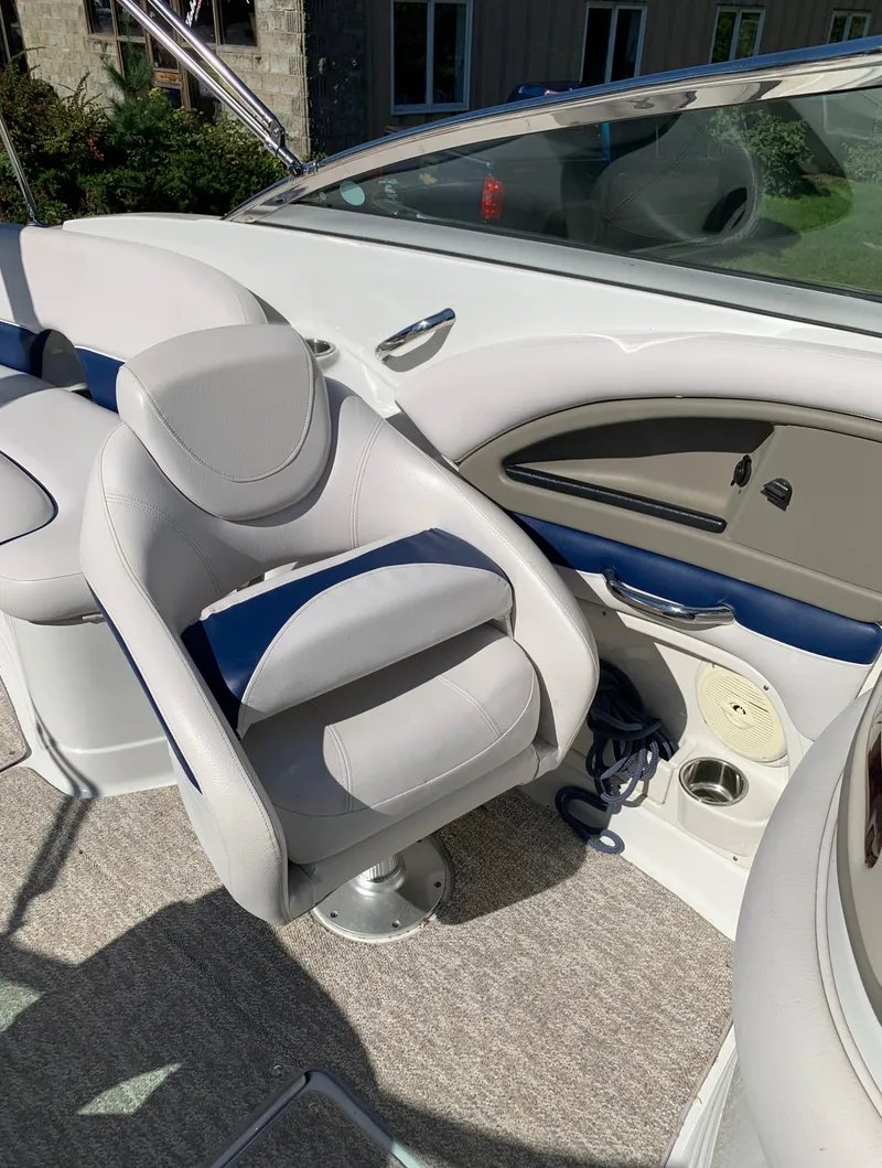 Slide: The Image of 2012 Crownline E6 boat interior with white and blue seating. - 36
