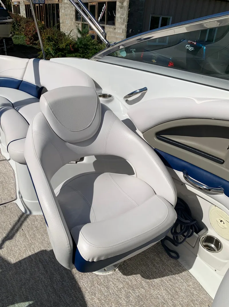 Slide: The Image of 2012 Crownline E6 boat interior with white and blue seating. - 37
