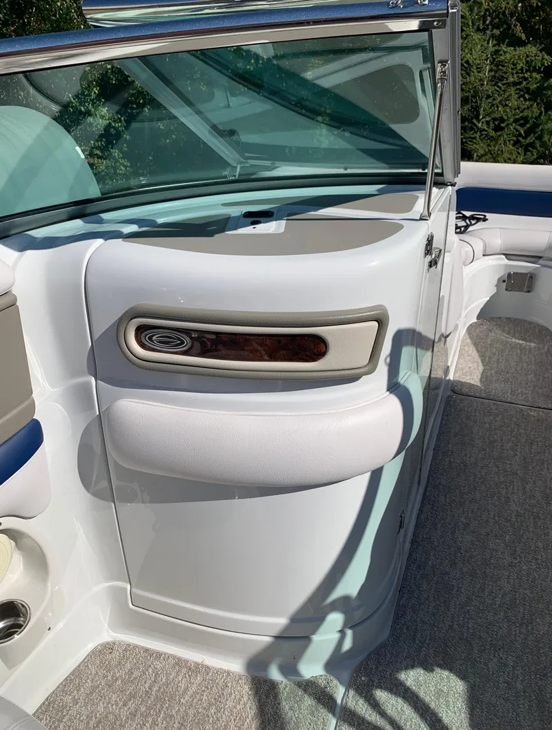 Slide: The Image of 2012 Crownline E6 boat interior with white and beige upholstery. - 38
