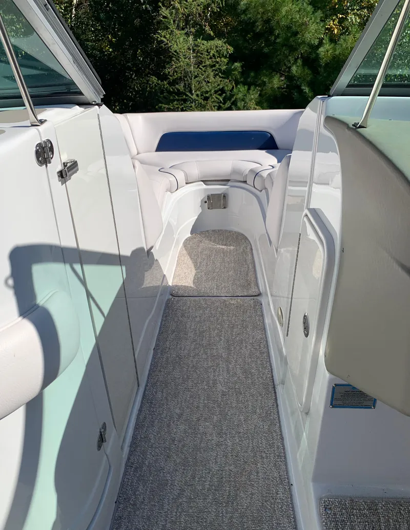 Slide: The Image of 2012 Crownline E6 boat interior with seating and carpeted floor. - 40