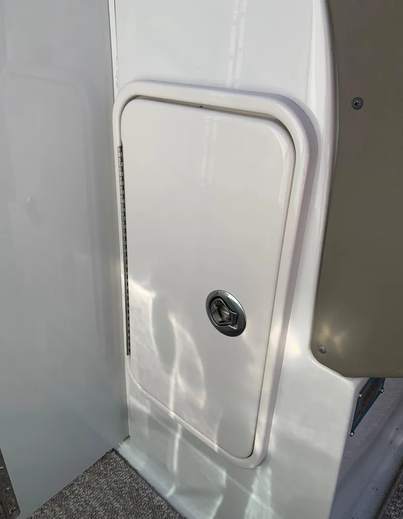 Slide: The Image of 2012 Crownline E6 boat storage compartment door. - 42