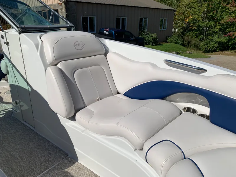Slide: The Image of 2012 Crownline E6 boat with luxurious white and blue seating. - 45