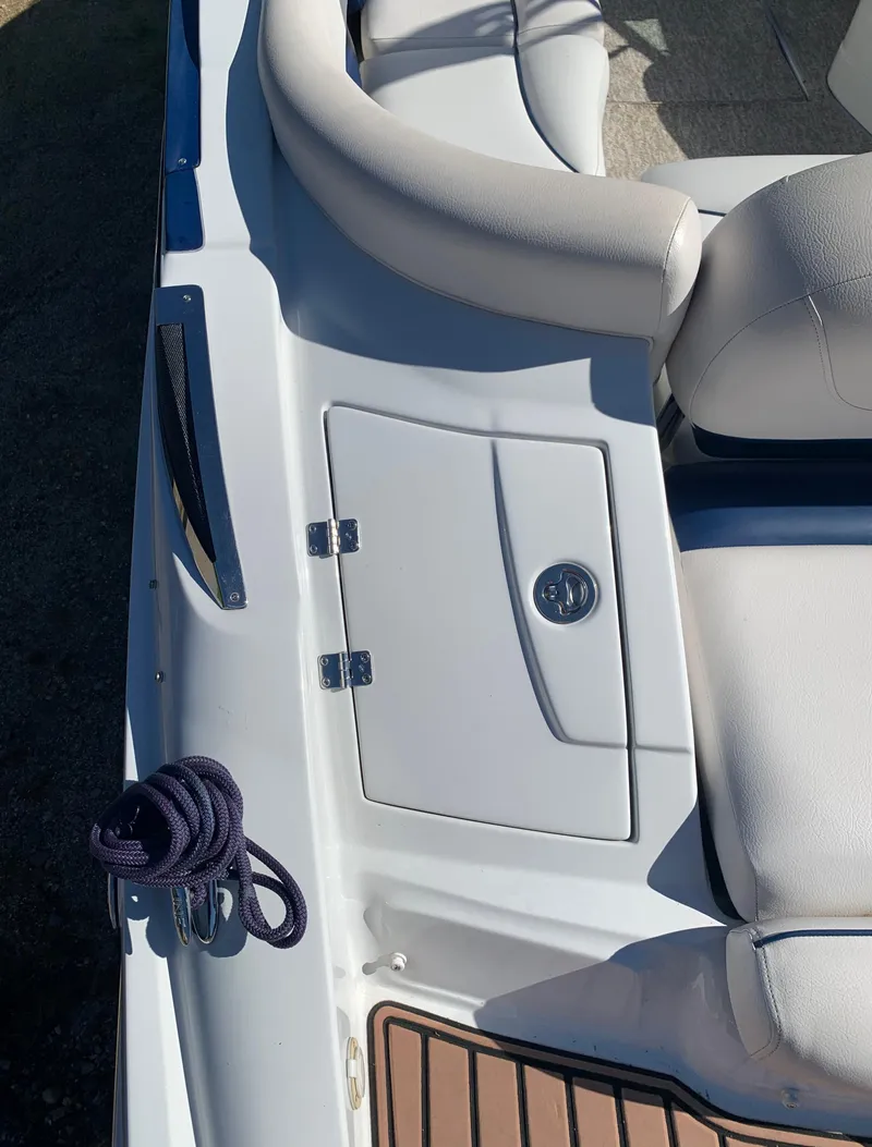 Slide: The Image of 2012 Crownline E6 boat interior with seating and storage compartment. - 9
