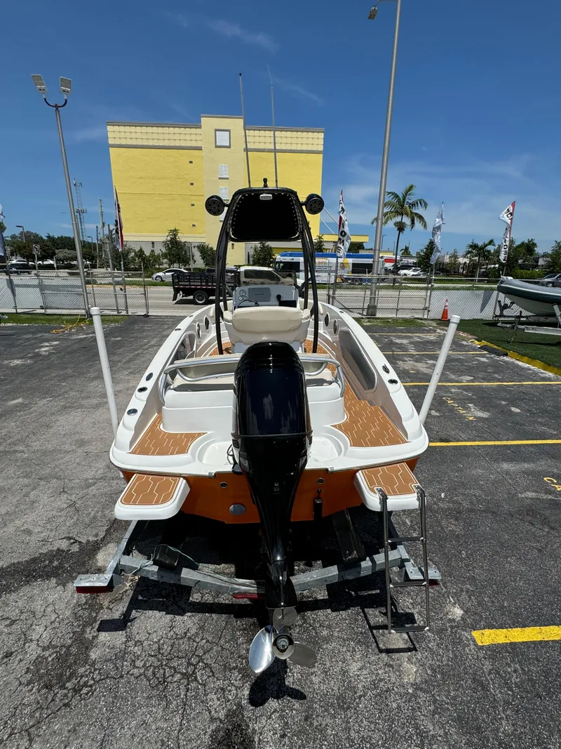 Slide: The Image of 2016 Pronautica 660 boat on trailer in parking lot. - 10