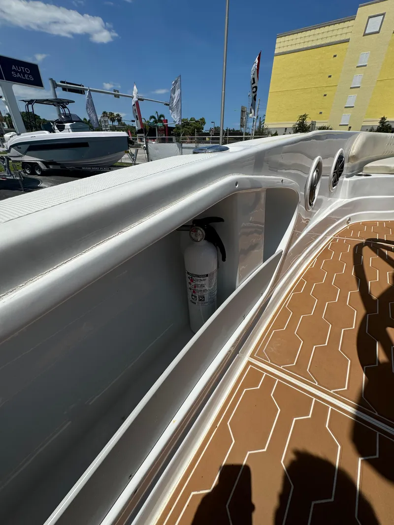 Slide: The Image of 2016 Pronautica 660 boat interior with fire extinguisher and teak flooring. - 16