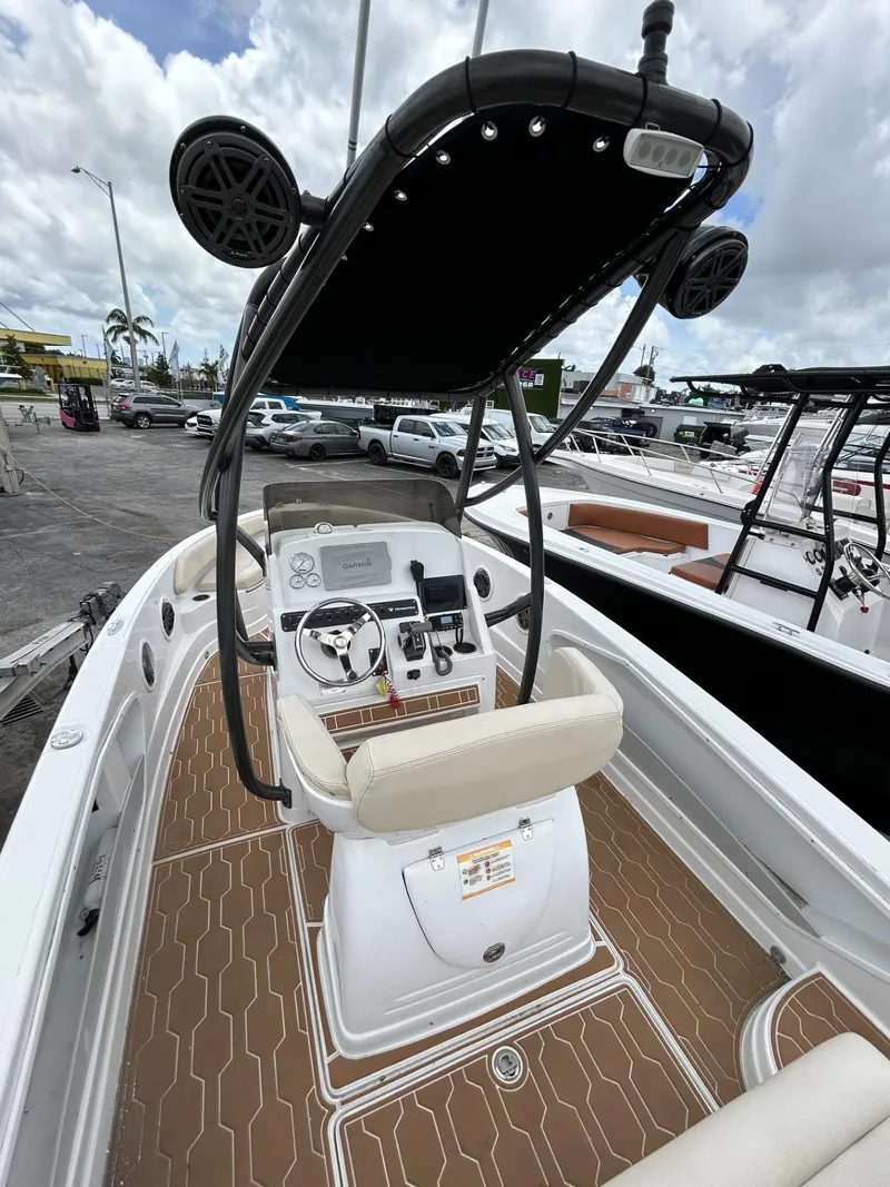 Slide: The Image of 2016 Pronautica 660 boat with center console and T-top. - 2