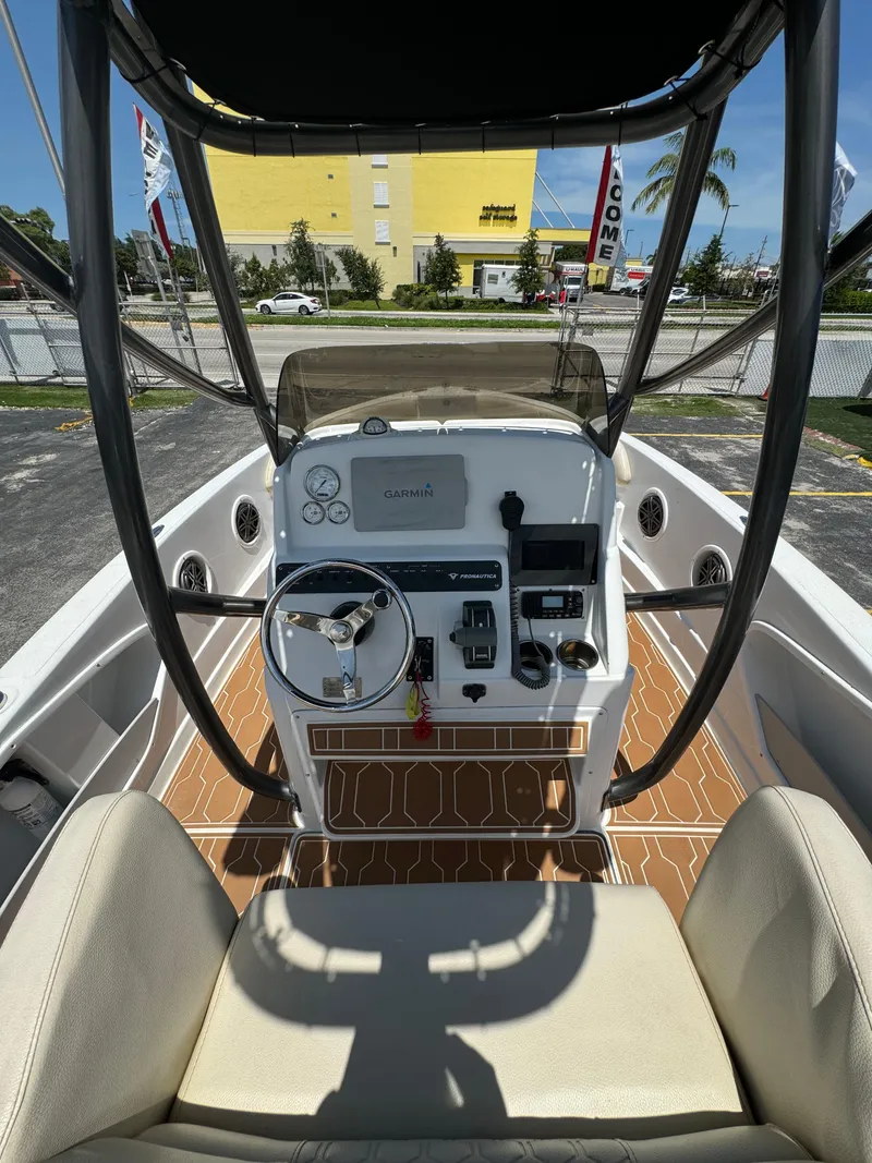 Slide: The Image of 2016 Pronautica 660 boat cockpit with steering wheel and control panel. - 20