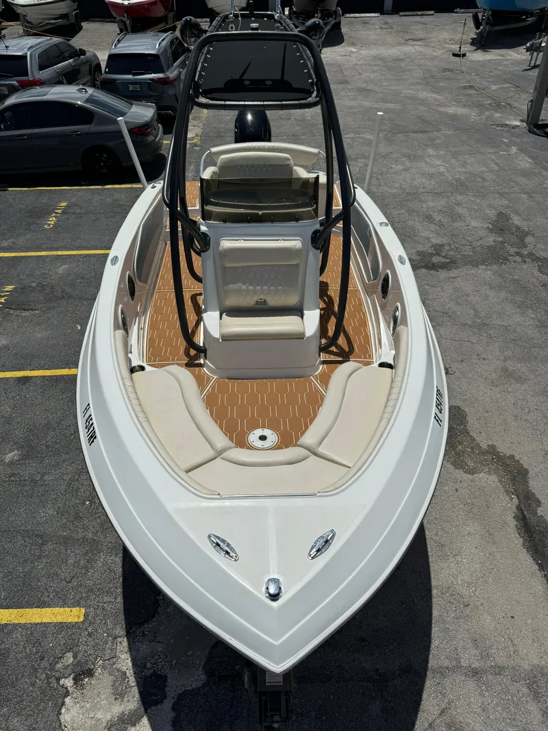 Slide: The Image of 2016 Pronautica 660 boat with teak deck, parked in a marina. - 23