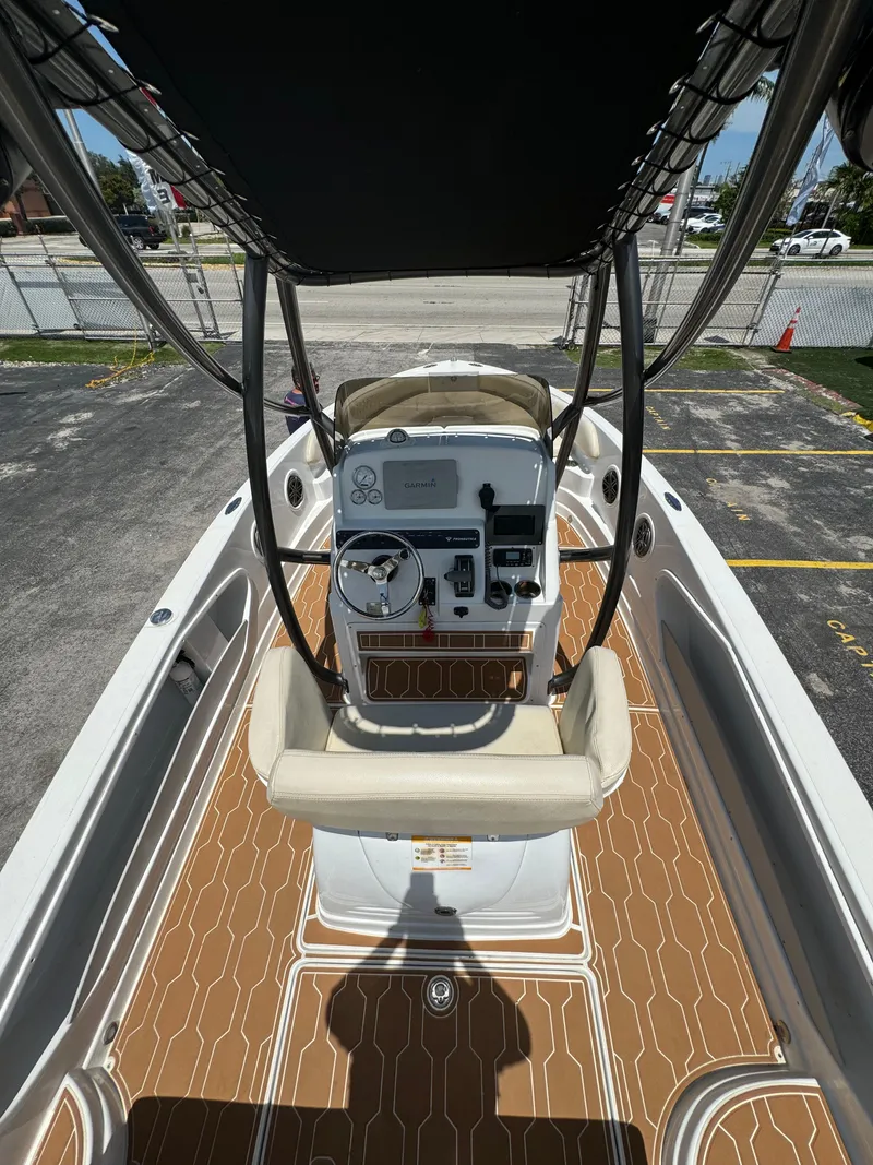 Slide: The Image of 2016 Pronautica 660 boat interior with helm and seating. - 24
