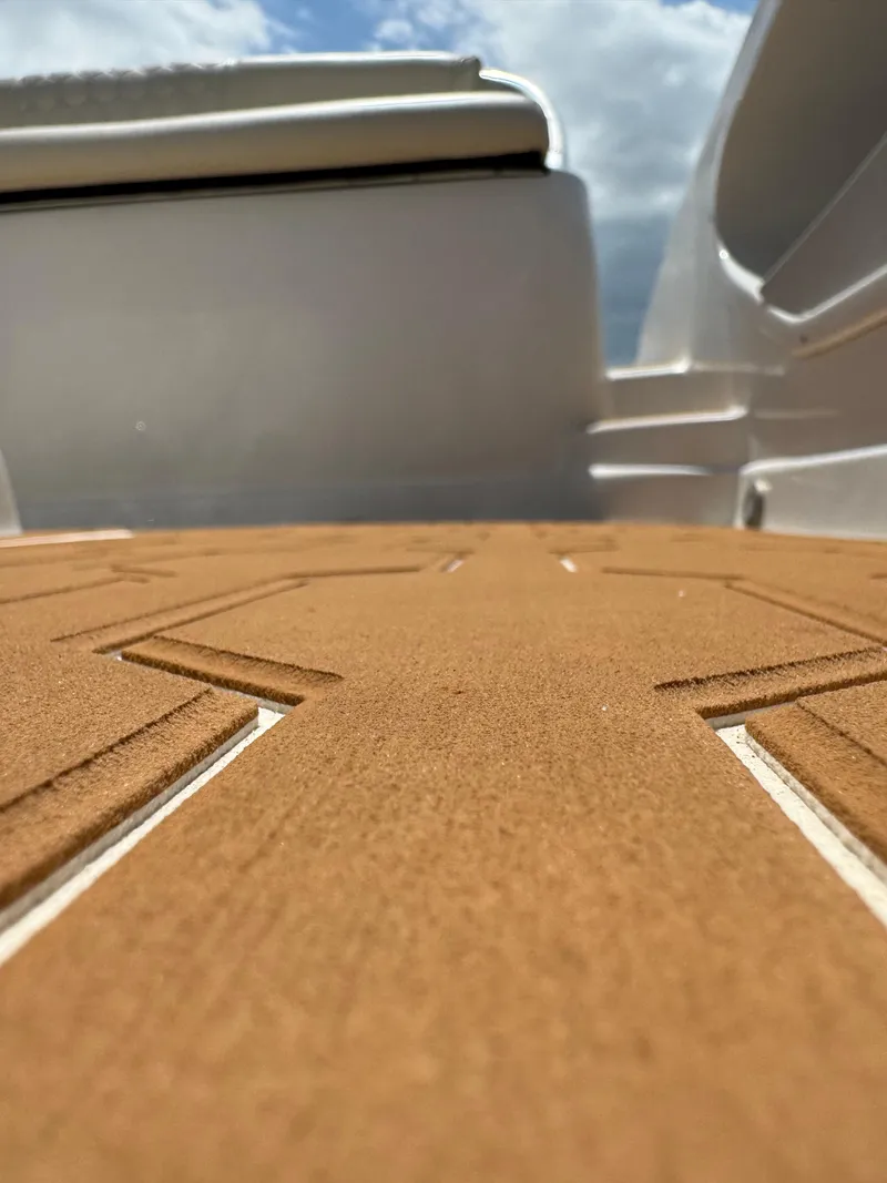 Slide: The Image of 2016 Pronautica 660 boat deck with teak flooring. - 28