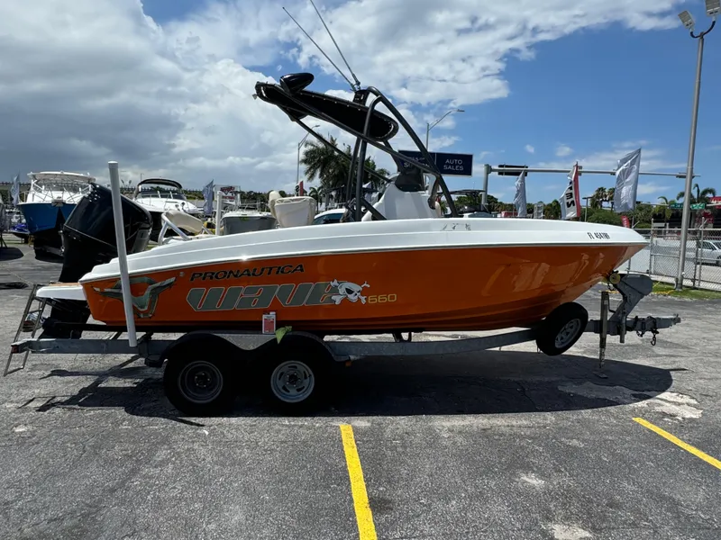 Slide: The Image of 2016 Pronautica 660 boat on a trailer in a marina. - 29