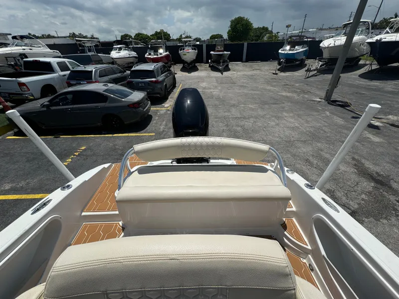 Slide: The Image of 2016 Pronautica 660 boat in a parking lot with other boats and cars. - 30