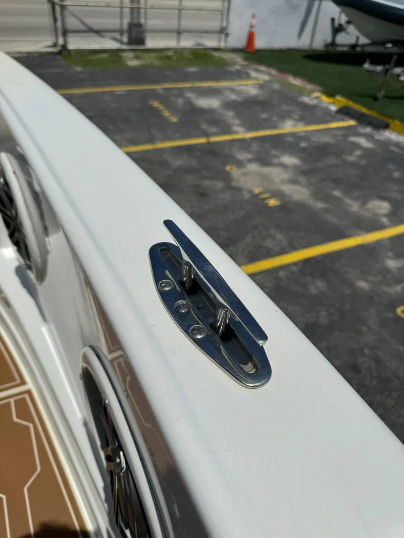 Slide: The Image of Close-up of a 2016 Pronautica 660 boat's cleat and deck details. - 32