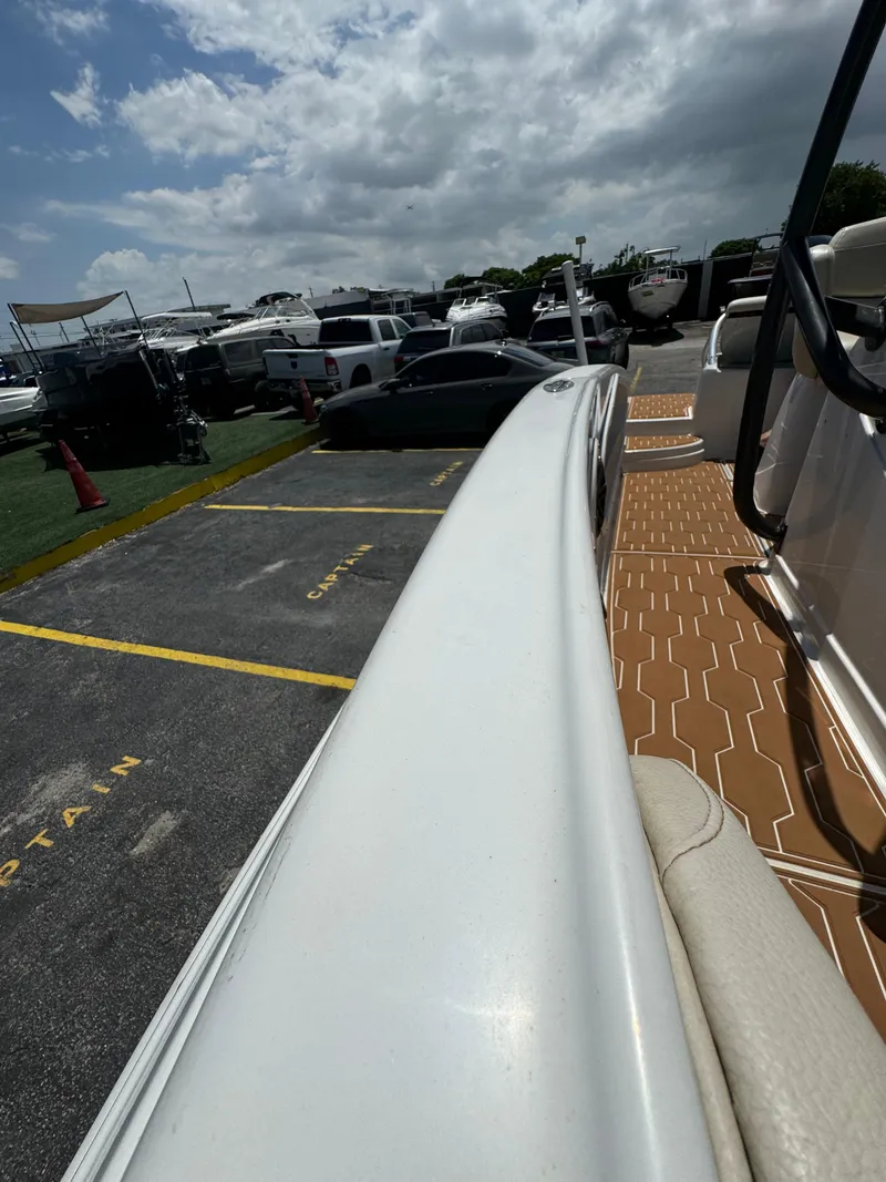 Slide: The Image of 2016 Pronautica 660 boat docked in a marina under a cloudy sky. - 36