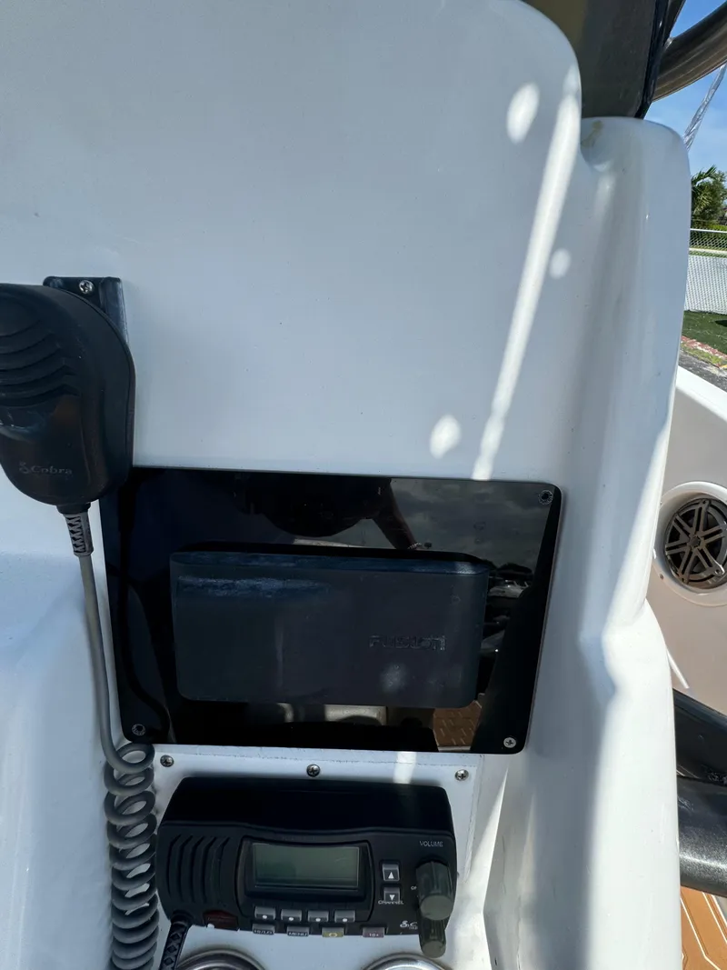 Slide: The Image of Control panel of a 2016 Pronautica 660 boat with radio and navigation equipment. - 38