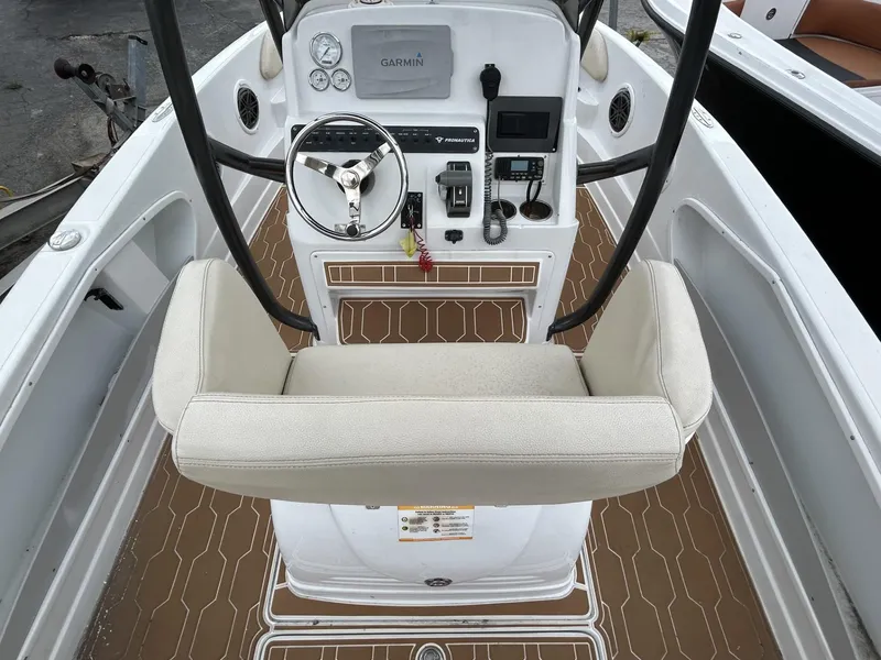Slide: The Image of 2016 Pronautica 660 boat cockpit with steering wheel and control panel. - 4