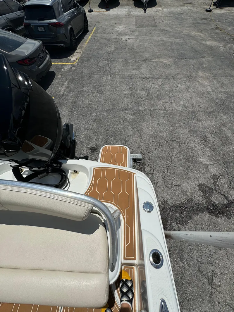 Slide: The Image of 2016 Pronautica 660 boat with wooden deck, parked in a lot. - 48