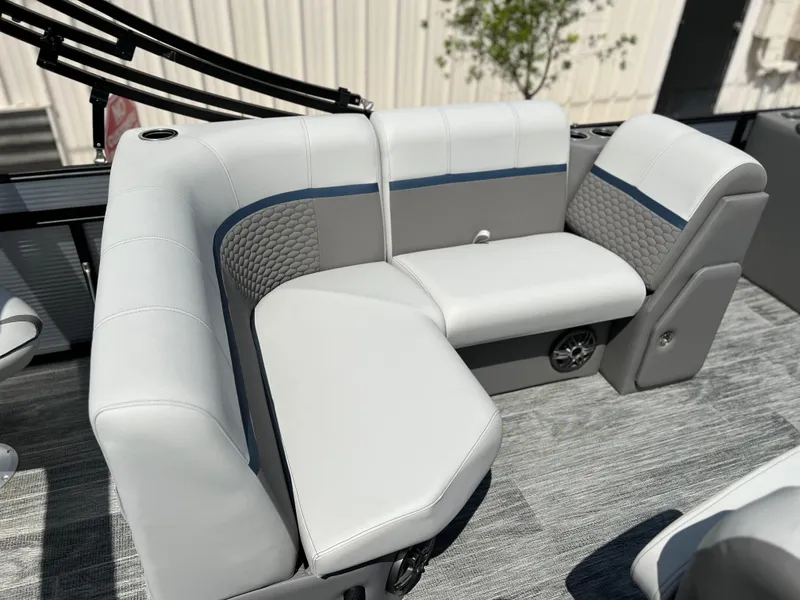 Slide: The Image of Qwest XRE 820 2024 boat interior with white and gray cushioned seating. - 11