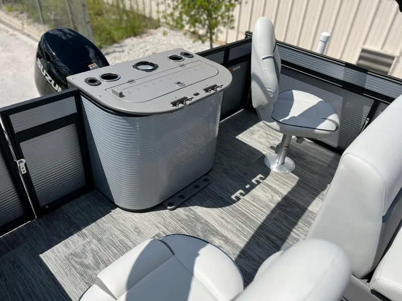 Slide: The Image of Interior of 2024 Qwest XRE 820 pontoon boat with seating and control console. - 12