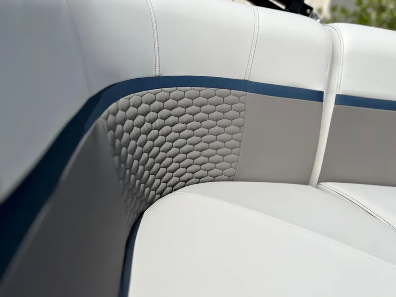 Slide: The Image of 2024 Qwest XRE 820 boat seat with white and gray upholstery and blue accents. - 14