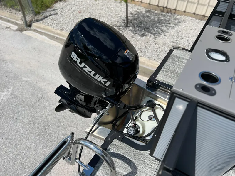 Slide: The Image of 2024 Qwest XRE 820 boat with Suzuki outboard motor. - 15