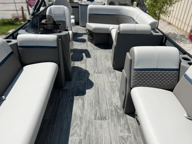 Slide: The Image of 2024 Qwest XRE 820 pontoon boat interior with luxurious seating and modern design. - 17
