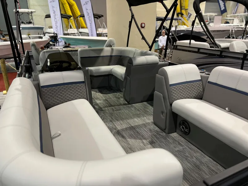 Slide: The Image of 2024 Qwest XRE 820 pontoon boat interior with luxurious seating. - 18