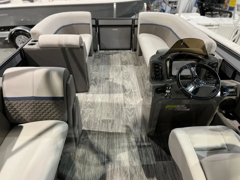 Slide: The Image of Interior of 2024 Qwest XRE 820 pontoon boat with modern seating and steering console. - 24
