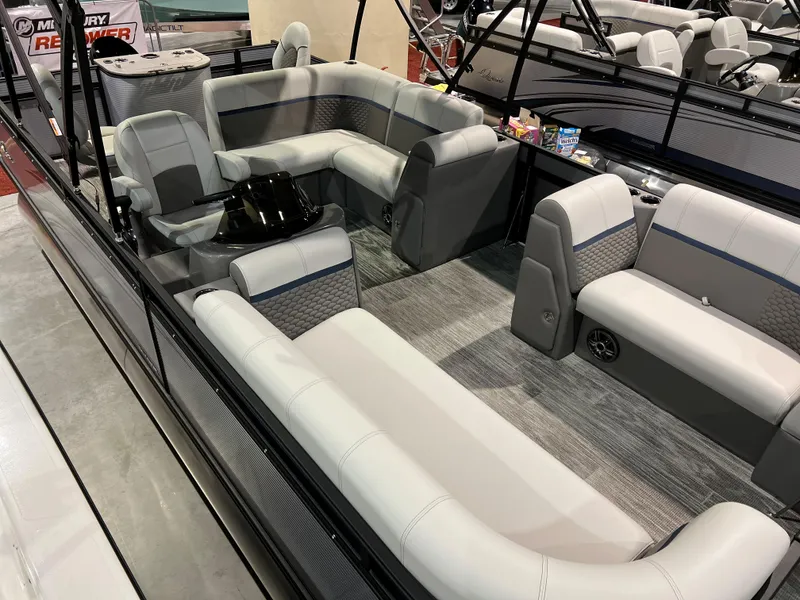 Slide: The Image of 2024 Qwest XRE 820 pontoon boat with spacious seating and modern interior design. - 26