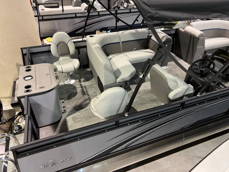 Slide: The Image of 2024 Qwest XRE 820 pontoon boat interior with seating and console. - 27