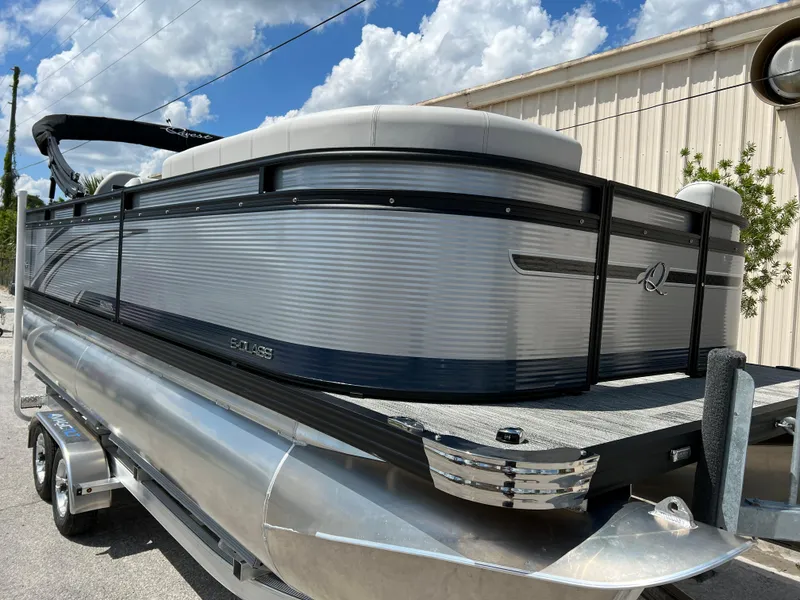 Slide: The Image of 2024 Qwest XRE 820 pontoon boat with sleek design and aluminum finish. - 5
