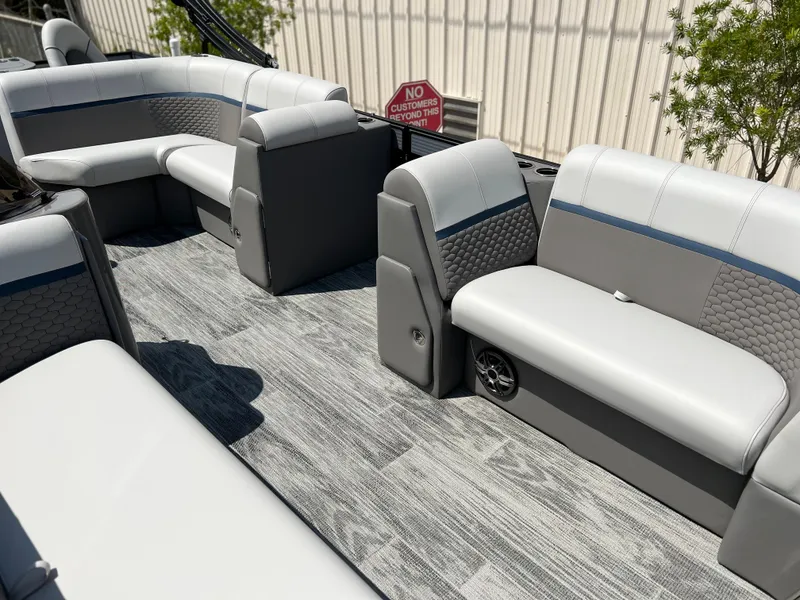 Slide: The Image of 2024 Qwest XRE 820 boat interior with gray and white seating, modern design. - 7