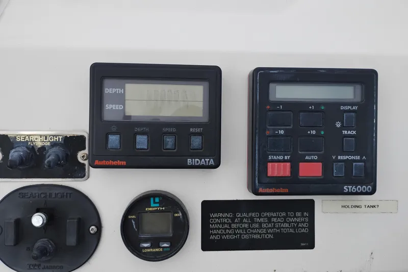 Slide: The Image of 1995 Bayliner 3988 Motoryacht dashboard with Autopilot and depth instruments. - 11