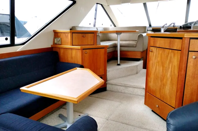 Slide: The Image of Interior of 1995 Bayliner 3988 Motoryacht with wood cabinetry and seating area. - 15