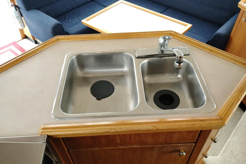 Slide: The Image of 1995 Bayliner 3988 Motoryacht kitchen sink with dual basins and faucet. - 22