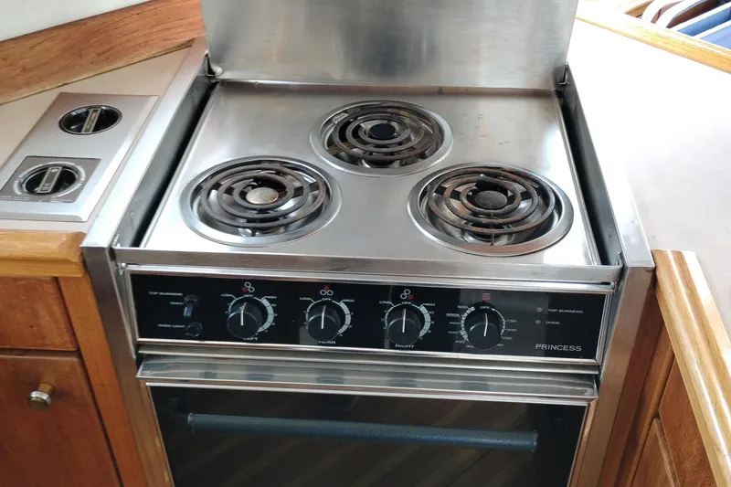 Slide: The Image of Stainless steel stove in 1995 Bayliner 3988 Motoryacht kitchen area. - 25